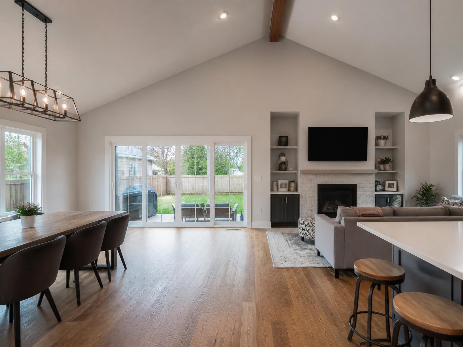 Open-concept living space inside a newly built home addition